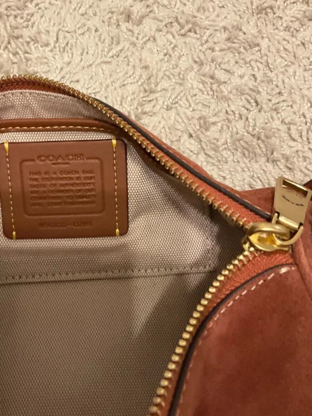 COACH barrel bag. brass/clay. CDy81.